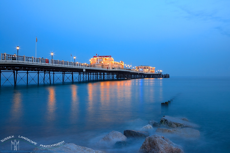 slides/Wothing Pier at Night.jpg sunrise sunset worthing west sussex coastline water seafront beach sand silhouette orange ball shoreham iceland volcano yellow long exposure milky ethereal sewage outlet outflow Wothing Pier at Night